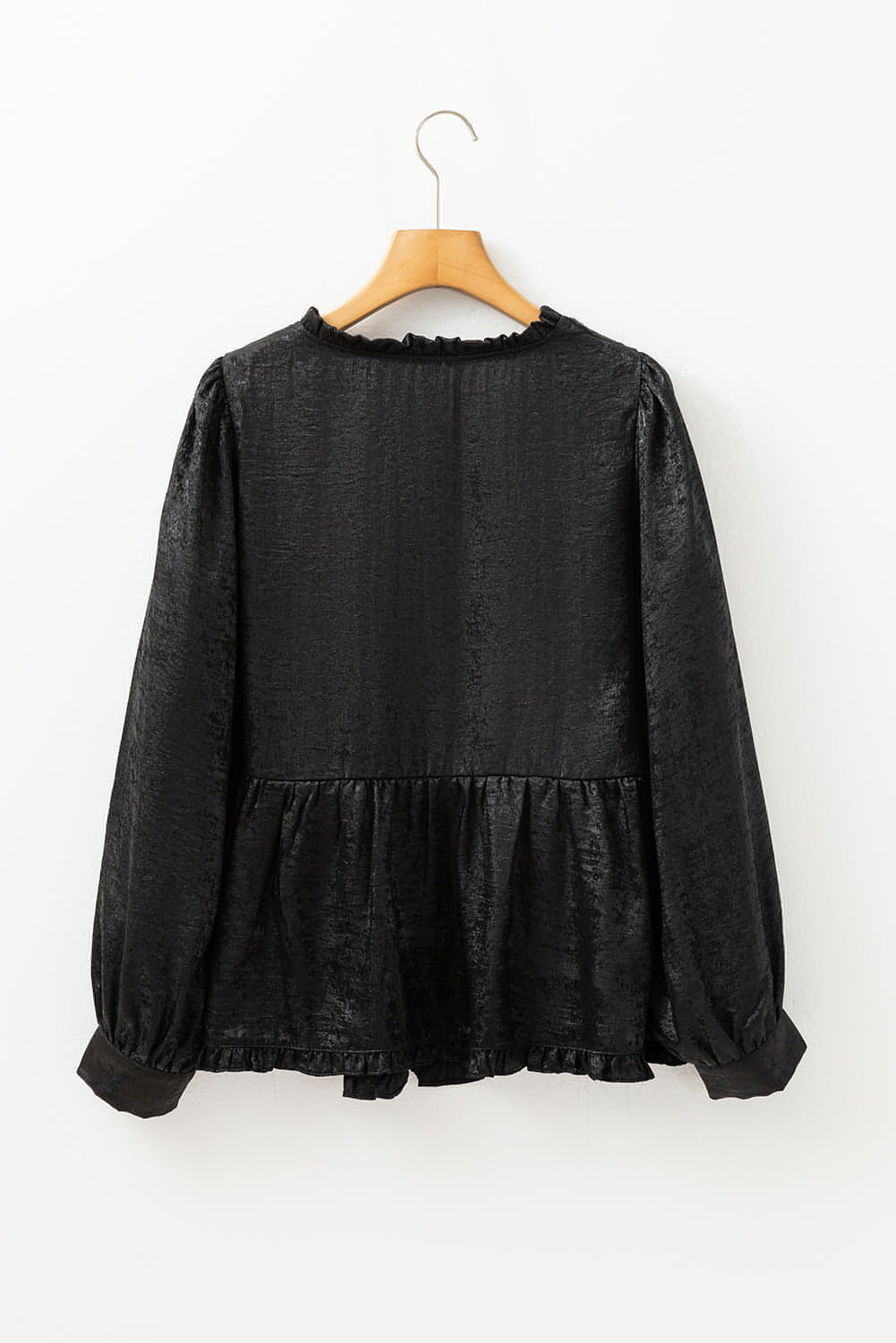 Blouse babydoll noire métallisée à volants et col en V à manches bouffantes