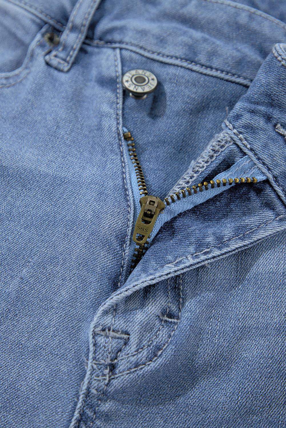 Dusk Blue High Rise Asymmetrisk Button Zip Fly Ripped Jeans